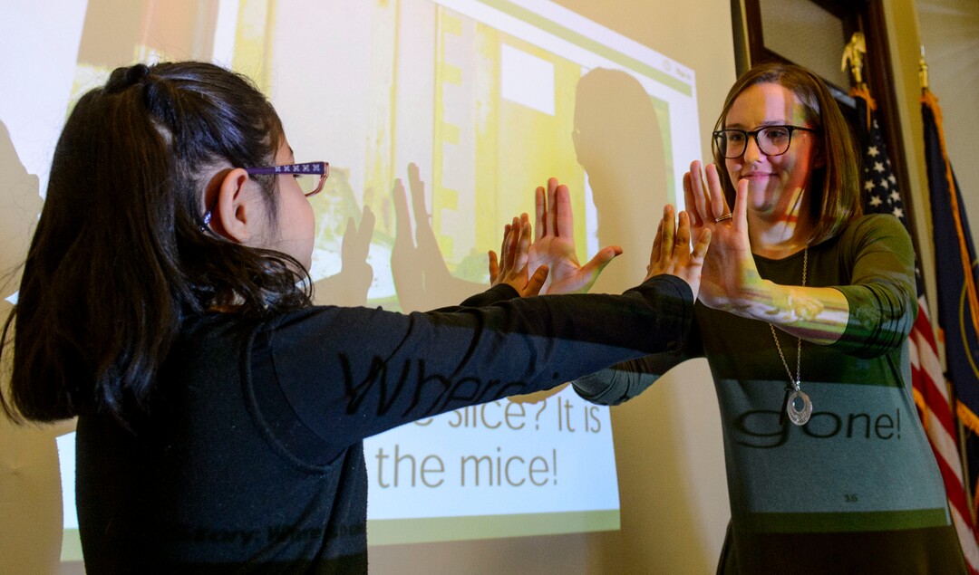 (Steve Griffin  |  The Salt Lake Tribune)  Jean Massieu School of the Deaf first grade teacher Mercy Persinger, right, calls hands with her student Tiana Rios during the Utah Schools for the Deaf and Blind "Kids in the Classroom at the Capitol day" in Salt Lake City Thursday February 8, 2018.
