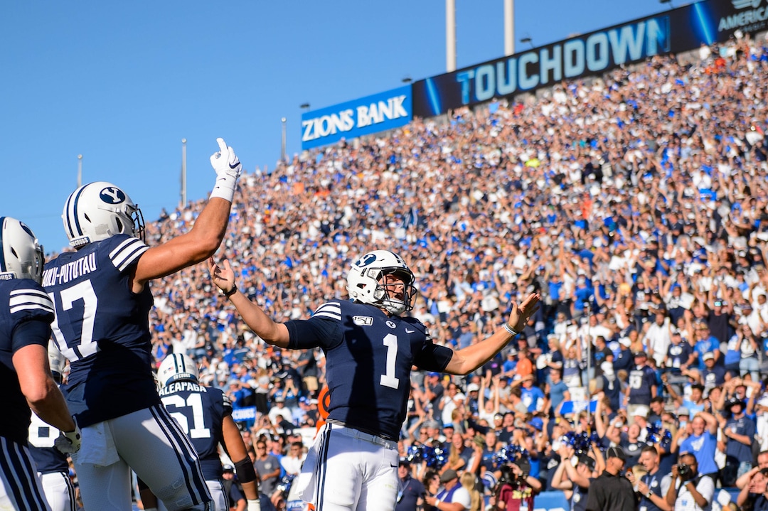 (Trent Nelson  |  The Salt Lake Tribune)  Brigham Young Cougars quarterback Zach Wilson (1) celebrates a late touchdown as BYU hosts USC, NCAA football in Provo on Saturday Sept. 14, 2019.