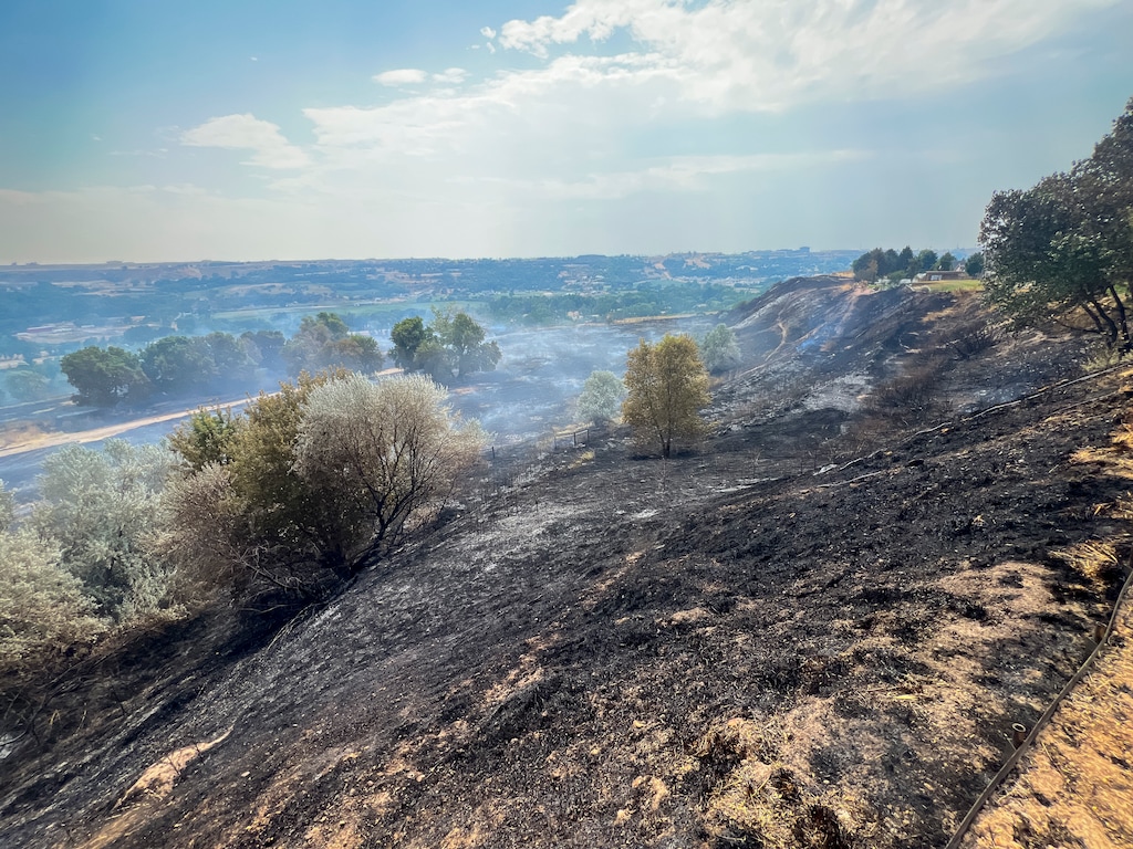 (Bethany Baker  |  The Salt Lake Tribune) Smoke billows from a fire in Washington Terrace on Monday, July 27, 2026.