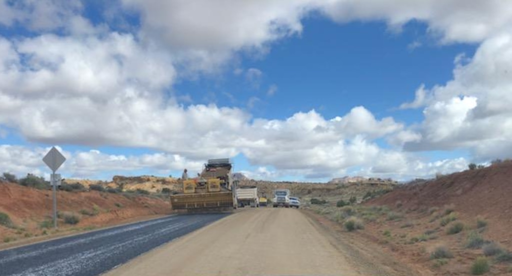 (Photo courtesy of Ray Bloxham, Southern Utah Wilderness Society) Garfield County crews on Tuesday chip-sealed the last unpaved stretch of the 67-mile Burr Trail on BLM land. Upgrades to historic road, passing through stunning canyon country to connect Boulder and Bullfrog, have long been fought over by environmentalists and county officials.