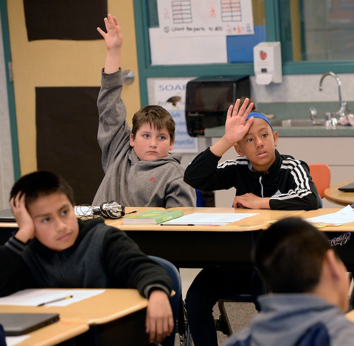 (Al Hartmann | The Salt Lake Tribune) Fifth graders work on a reading assignment in Kathleen Wilson's language arts class at Riley Elementary School in Salt Lake City Tuesday April 10, 2018. Utah’s average scores on the Nation’s Report Card for 2017 have improved from two years ago, but state officials remain concerned that minority and low-income students in the state continue to lag behind their peers.