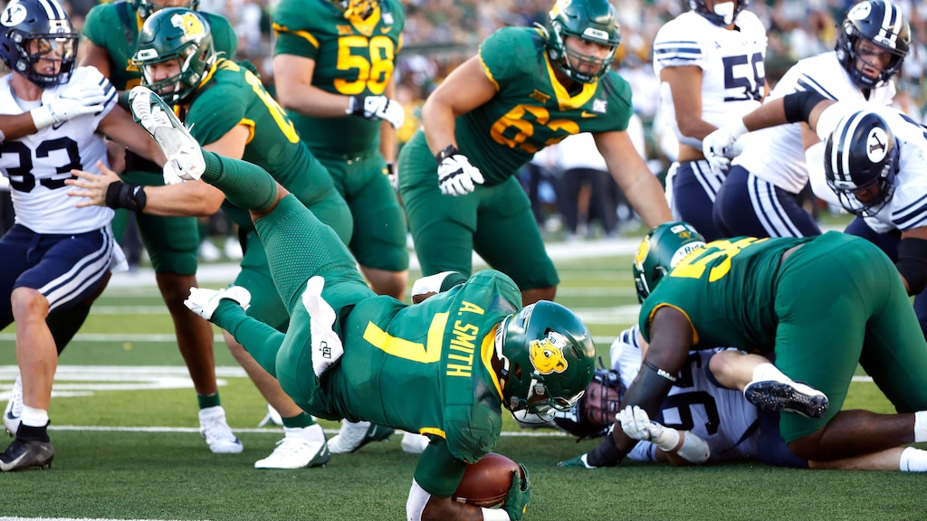 Baylor running back Abram Smith (7) dives for a touchdown against BYU during the second half of an NCAA college football game, Saturday, Oct. 16, 2021, in Waco, Texas. Baylor won 38-24. (AP Photo/Ron Jenkins)