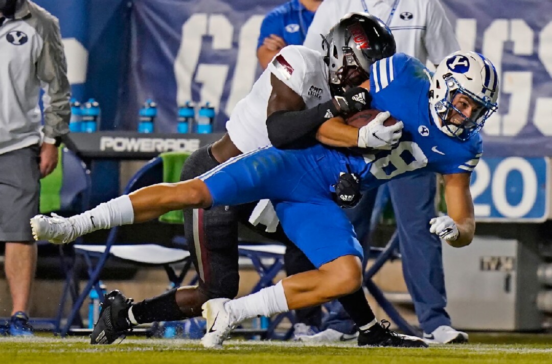 Troy safety Dell Pettus (31) tackles BYU wide receiver Gunner Romney during the first half during an NCAA college football game Saturday, Sept. 26, 2020, in Provo, Utah. (AP Photo/Rick Bowmer, Pool)