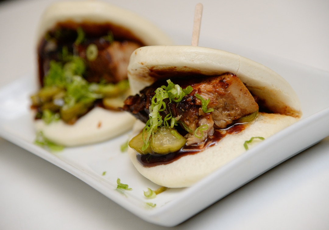 (Francisco Kjolseth  |  The Salt Lake Tribune)  Braised pork belly inside steamed buns at the Angry Korean fusion restaurant in South Jordan.