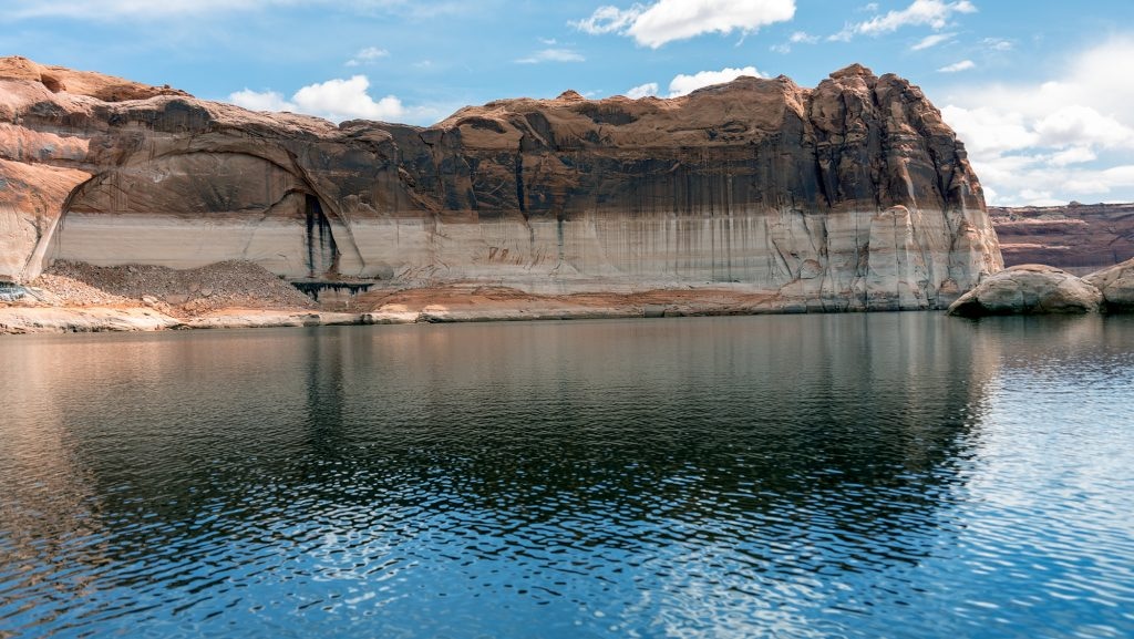(Alysha Lundgren | St. George News) Clouds reflect in the waters at Lake Powell, March 26, 2024. Lake Powell hit its peak capacity for 2024 this week.