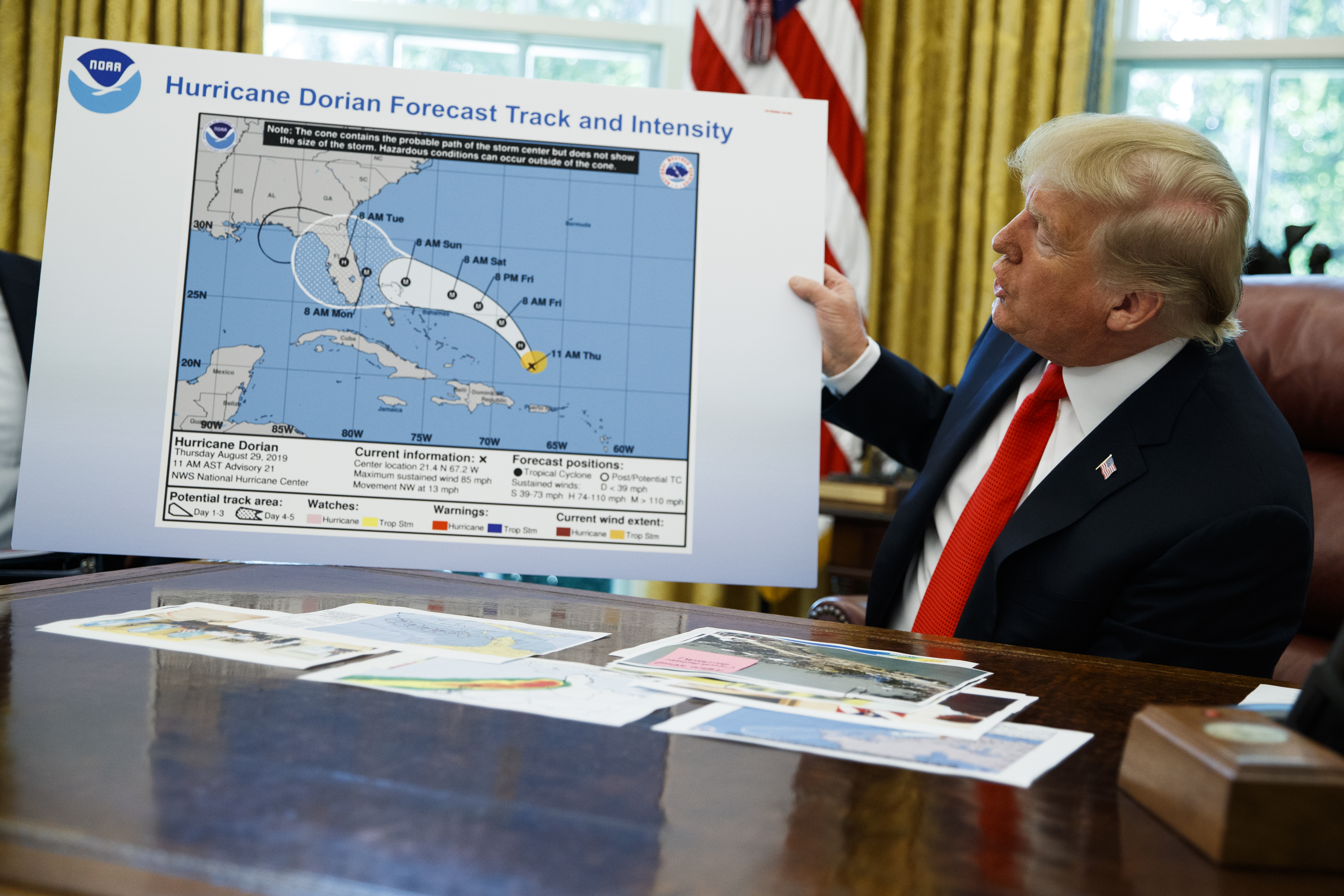 (Evan Vucci | AP file photo)

In this Sept. 4, 2019, photo, President Donald Trump holds a chart as he talks with reporters after receiving a briefing on Hurricane Dorian in the Oval Office of the White House in Washington. A report from the National Academy of Public Administration released on June 15 says that NOAA’s acting chief Neil Jacobs and its then-communications director, Julie Kay Roberts, twice breached the agency’s rules designed to protect scientists and their work from political interference, putting out a press statement that “did not follow NOAA’s normal proves and appear to be the result of strong external pressure.”