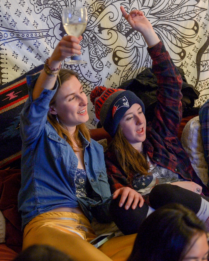 (Leah Hogsten | The Salt Lake Tribune) Rosanise Odell and Amanda Sevigny raise their glasses in support of their friend, first-time Olympian Darian Stevens. Westminster students and friends of first-time Olympian Darian Stevens gathered for a watch party in Sugar House to watch Stevens compete in her first qualifying ski slopestyle competition run Friday, Feb. 16, 2018. Stevens is a graduate of the Park City Winter Sports School and a business major at Westminster.