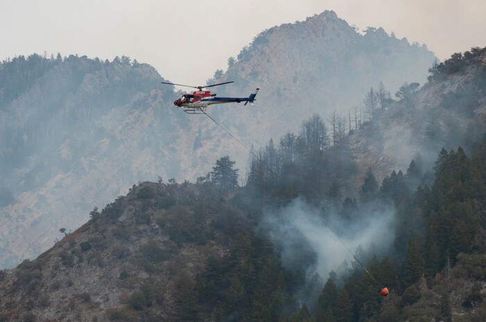 (Francisco Kjolseth  |  The Salt Lake Tribune) Air crews battle a fire in Neffs Canyon on the north side of Mount Olympus on Tuesday, Sept, 22, 2020.