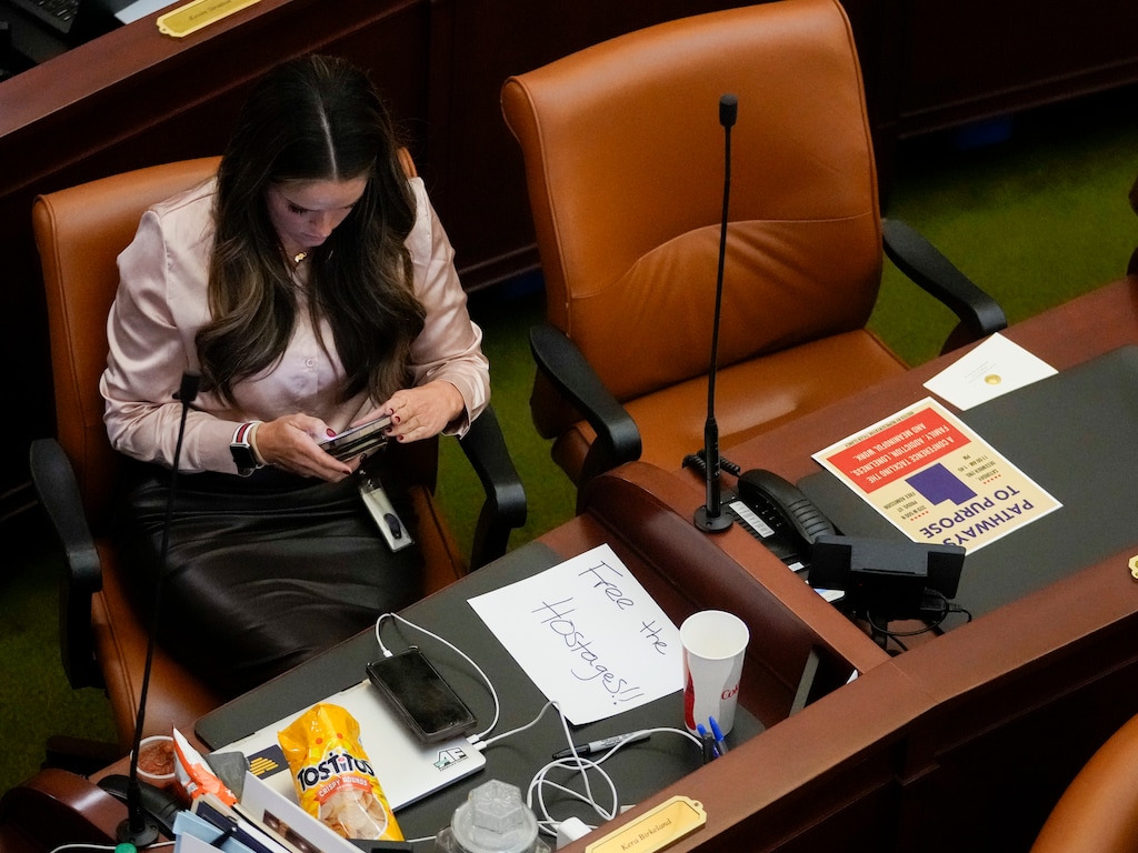 (Bethany Baker  |  The Salt Lake Tribune) Rep. Kera Birkeland sits at her desk with a sheet of paper reading “Free the hostages!!” as the Utah House of Representatives considers a resolution to show support for Israel during an Extraordinary Session at the Utah Capitol in Salt Lake City on Wednesday, Nov. 15, 2023.