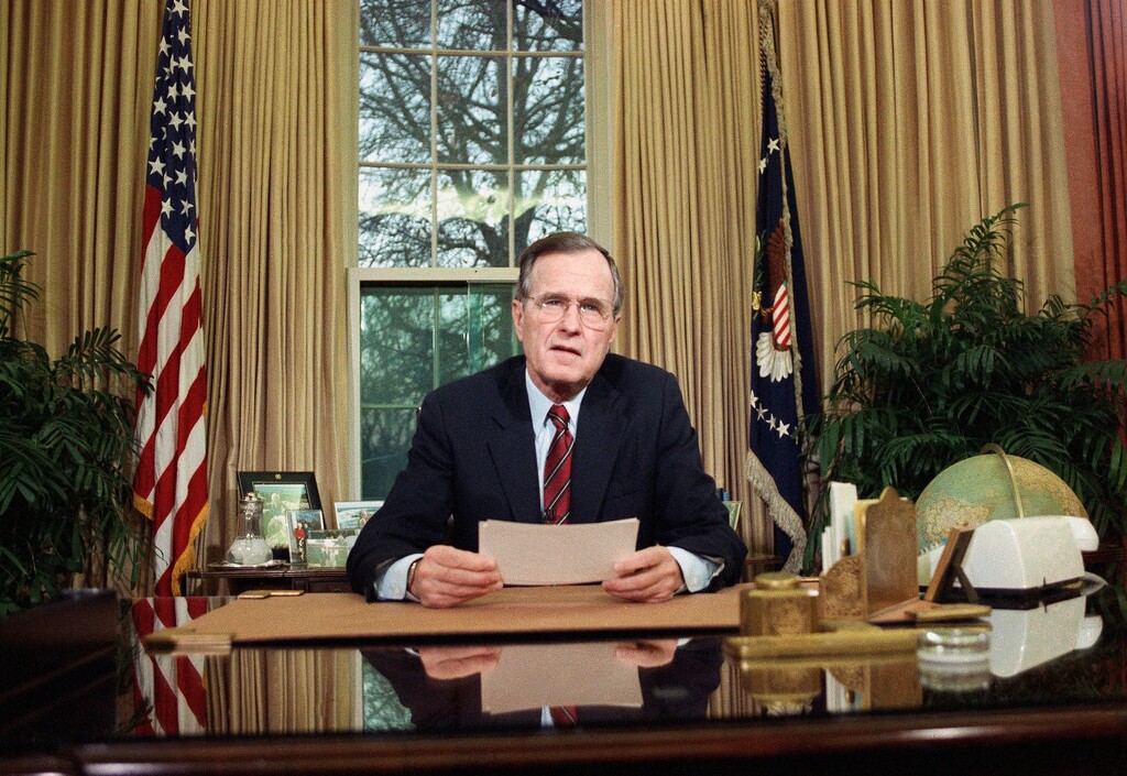 (Barry Thumma | AP file photo)

In this Dec. 20, 1989, photo, President George H.W. Bush addresses the nation on television from the Oval Office.