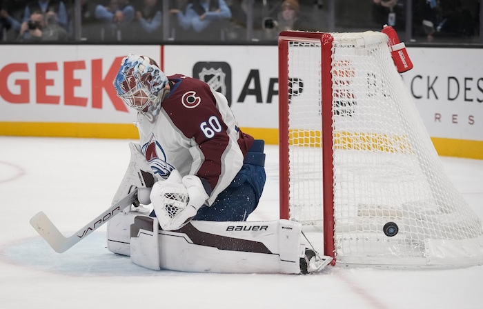 (Bethany Baker | The Salt Lake Tribune) The puck flies by the net as Colorado Avalanche goaltender Justus Annunen (60) blocks during the game between the Utah Hockey Club and the Colorado Avalanche at the Delta Center in Salt Lake City on Thursday, Oct. 24, 2024.