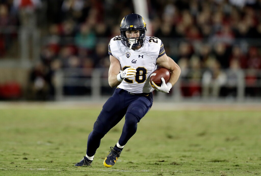 FILE - In this Nov. 18, 2017, file photo, California running back Patrick Laird runs against Stanford during the first half of an NCAA college football game in Stanford, Calif. Cal now hopes that the increased focus on defense that led to 14 fewer points per game allowed and the culture change that head coach Justin Wilcox instilled in year one leads to a bowl game this season. "It's a transition to more of a winning mentality," running back Patrick Laird said. "In the past, there's been not a victim mentality, but things are tough, it's hard for us to win. Now we feel like we can win. ... Everyone collectively feels we are capable of winning and we can do it." (AP Photo/Marcio Jose Sanchez, File)