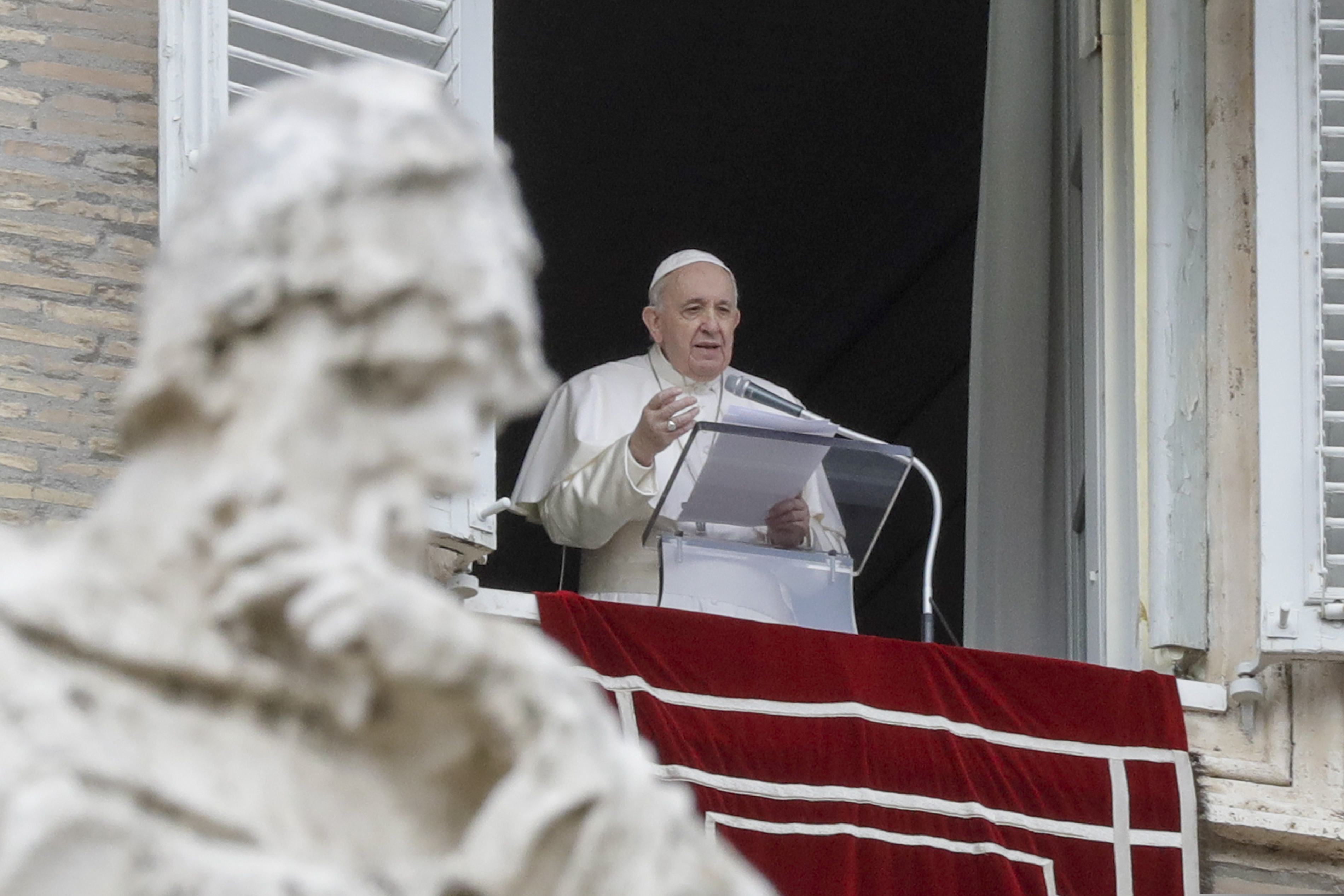 In this Dec. 8, 2020 file photo, Pope Francis delivers his message during the Angelus noon prayer from the window of his studio overlooking St.Peter's Square, on the Immaculate Conception day, at the Vatican. (AP Photo/Andrew Medichini, file)