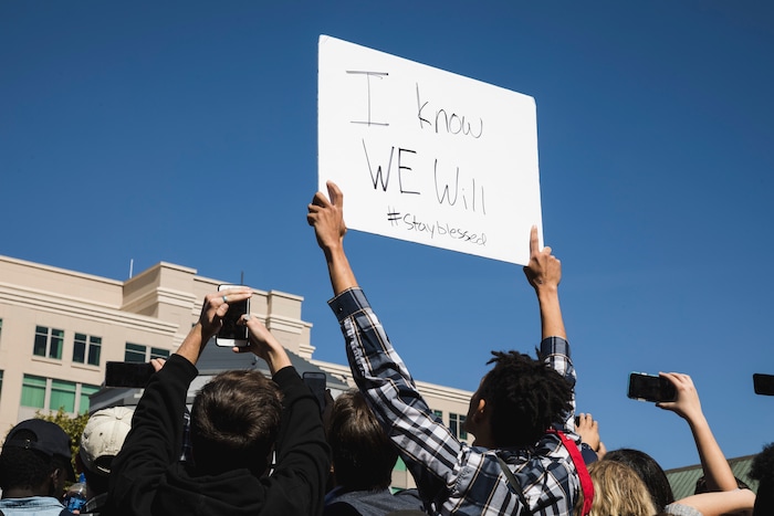 (Clark Clifford  |  Special to The Salt Lake Tribune) A fan holds their handmade sign towards the performers at Kanye West's Sunday Service at The Gateway in Salt Lake City on Saturday, Oct. 5, 2019.
