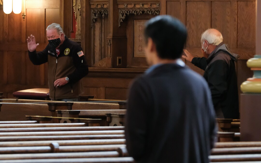 (Francisco Kjolseth  |  The Salt Lake Tribune) Catholic parishioners show each other signs of peace from a distance as they celebrate daily Mass at Cathedral of the Madeleine in Salt Lake City on Friday, May 8, 2020.