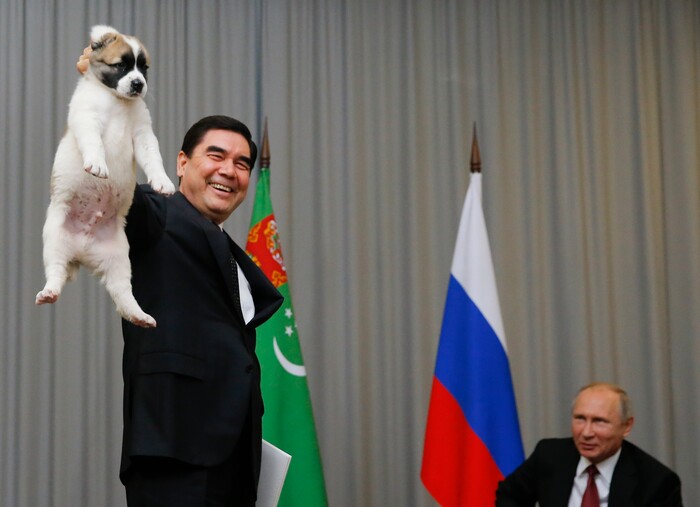 Turkmenistan's President Gurbanguly Berdymukhamedov, left, presents a puppy to Russian President Vladimir Putin during their meeting in the Bocharov Ruchei residence in the Black Sea resort of Sochi, Russia, Wednesday, Oct. 11, 2017. The presidents met at the sidelines of a summit of leaders of ex-Soviet nations in Sochi. (Maxim Shemetov, Pool Photo via AP)