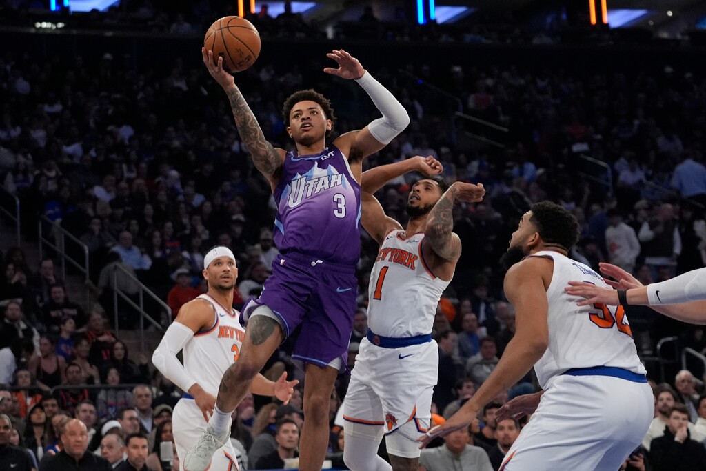 (Frank Franklin II | AP) Utah Jazz's Keyonte George (3) drives past New York Knicks' Cameron Payne (1) and Karl-Anthony Towns (32) during the first half of an NBA basketball game Wednesday, Jan. 1, 2025, in New York.