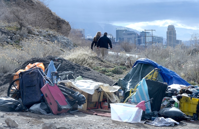(Al Hartmann  |  The Salt Lake Tribune) 	
Salt Lake City police officers Lt. Robin Heiden and Cpt. Tyrone Farillas walk the hills above Victory Road to advise homeless people camped in the hills of a mobile homeless outreach center, on Thursday Feb. 15, 2018.