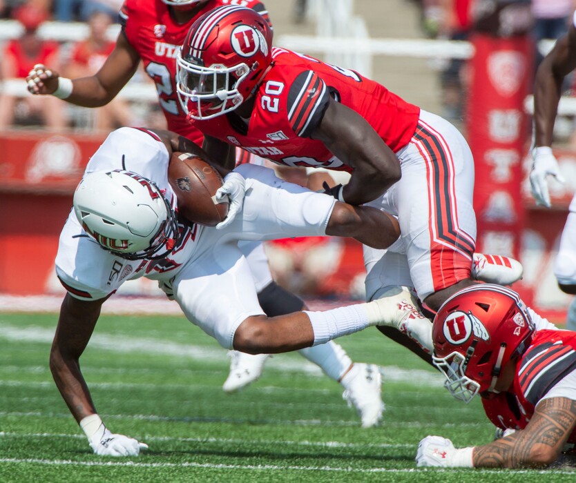 (Rick Egan  |  Tribune file photo)    Utah Utes linebacker Devin Lloyd (20) sacks Northern Illinois Huskies quarterback Ross Bowers (12), in football action between Northern Illinois Huskies and Utah Utes at Rice-Eccles Stadium, Saturday, Sept. 7, 2019.