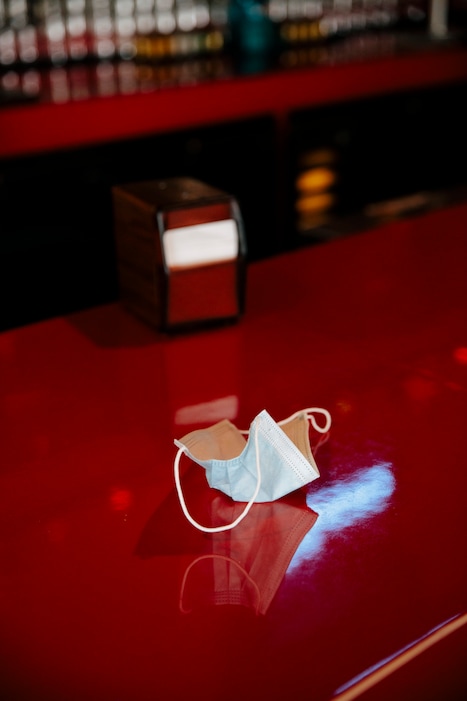 (Kendrick Brinson | The New York Times)
A discarded mask at a bar in Los Angeles, June 15, 2021. "The desperate desire to get back to normal is understandable," writes New York Times columnist Michelle Goldberg. "What's odd is seeing the absence of normality as a political betrayal instead of an epidemiological curveball."