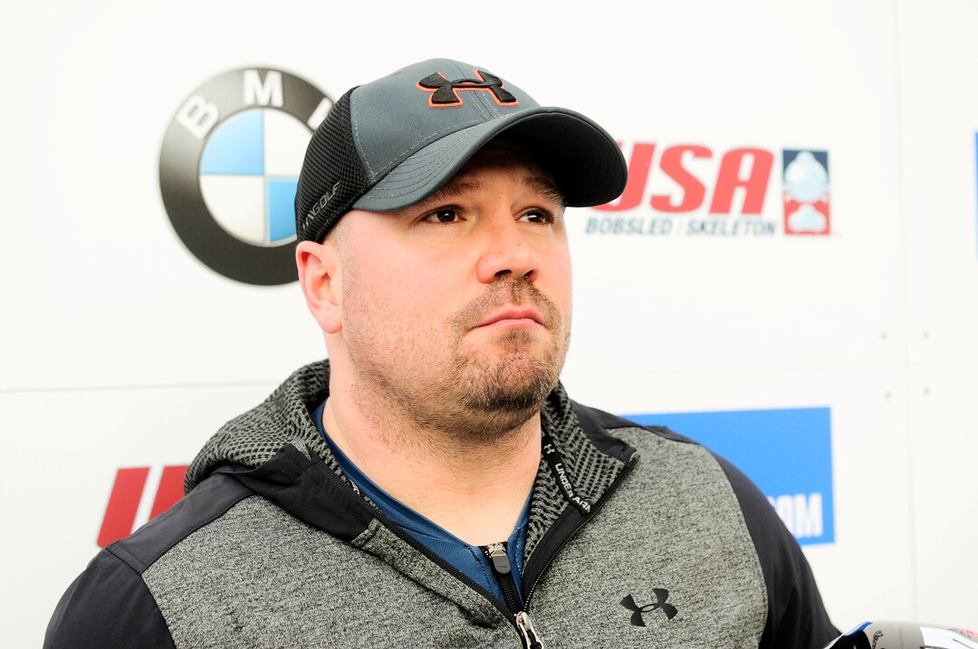 Driver Steven Holcomb, of the United States, talks with reporters in the finish area after winning the mens two-man bobsled World Cup race  on Friday, Dec. 16, 2016, in Lake Placid, N.Y. (AP Photo/Hans Pennink)

