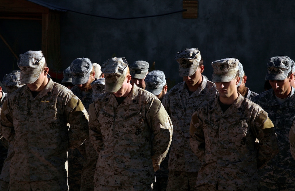 (Maya Alleruzzo | AP file photo)

In this photo taken Monday, Nov. 9, 2009, U.S. service members are seen during a memorial ceremony for a comrade killed on Saturday in Afghanistan's Farah province. Moscow and Washington are intertwined in a complex and bloody history in Afghanistan, with both suffering thousands of dead and wounded in conflicts lasting for years. Now both superpowers are linked again over Afghanistan, with intelligence reports indicating Russia secretly offered bounties to the Taliban to kill American troops there. But analysts suggest that the two adversaries actually have more in common, especially when it comes to what they want to see in a postwar Afghanistan: a stable country that does not serve as a base for extremists to export terrorism. Both countries also are aligned in their opposition to militants from the Islamic State group.