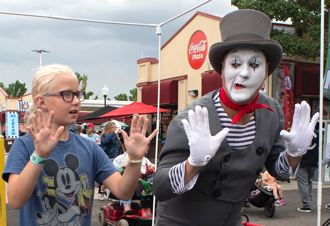 (Rick Egan  |  The Salt Lake Tribune)   Ella Nay 9, from West Jordan is trapped in an imaginary box with Chris Yerlig aka "Mimealot" at the Utah State Fair, Sunday, Sept. 8, 2019.