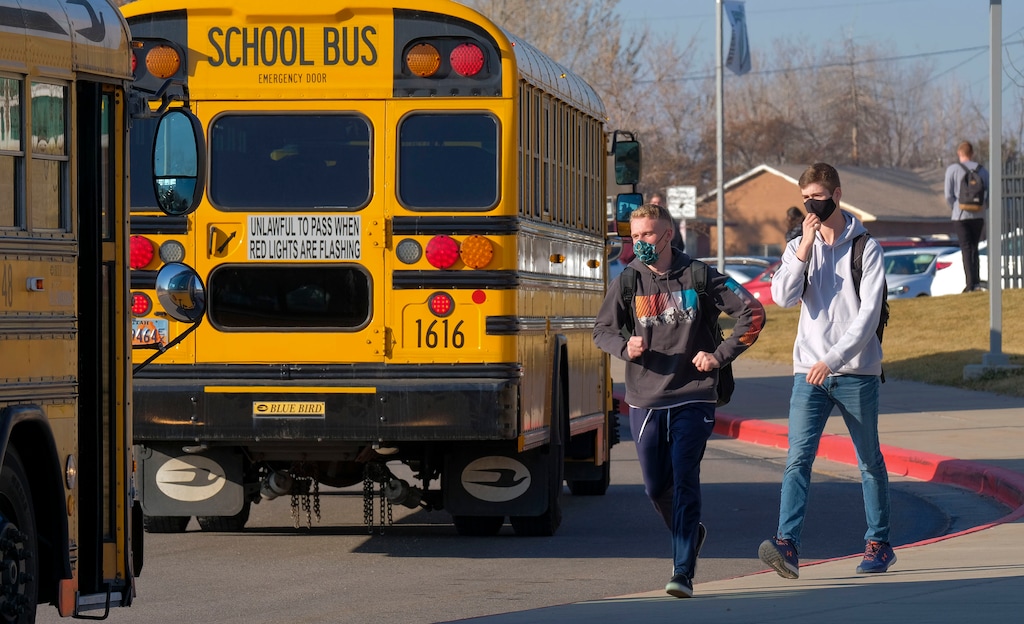 (Leah Hogsten | The Salt Lake Tribune) Syracuse High School students file out of school on Dec. 7, 2020 before it was shut down for two weeks due to an outbreak. A state audit recommends moving away from the 1% threshold for a "soft closure" after many schools had to close several times this fall.