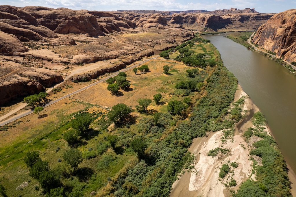 (Trent Nelson  |  The Salt Lake Tribune) The Colorado River flows next to Kane Creek Boulevard in Moab on Thursday, July 27, 2023.