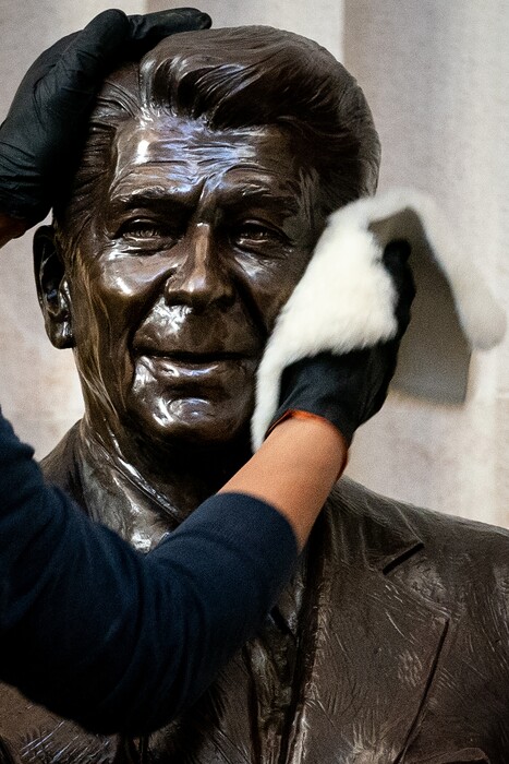 (Erin Schaff | The New York Times)

A worker cleans a statue of former President Ronald Reagan at the Capitol Rotunda in Washington on Jan. 12, 2021. "The year 2021, though, is the first time a reasonable Republican could listen to my pitch and answer, but what if history is repeating itself, and we’re back in Reagan’s world?" ” writes The New York Times columnist Ross Douthat.