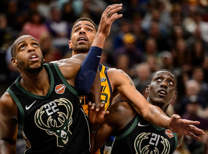 (Trent Nelson | The Salt Lake Tribune)  Milwaukee Bucks forward Khris Middleton (22), Utah Jazz forward Thabo Sefolosha (22), and Milwaukee Bucks guard Tony Snell (21) as the Utah Jazz host the Milwaukee Bucks, NBA basketball in Salt Lake City Saturday November 25, 2017.