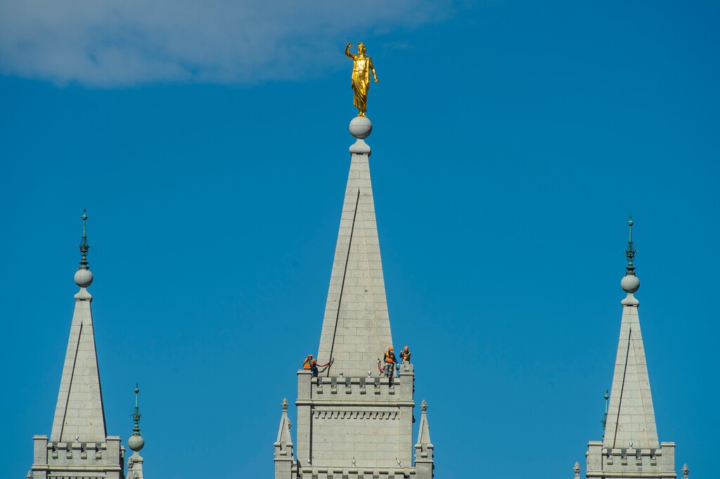 (Rick Egan  |  The Salt Lake Tribune)    Workers on the spire of the Salt Lake Temple, Tuesday April 21, 2020