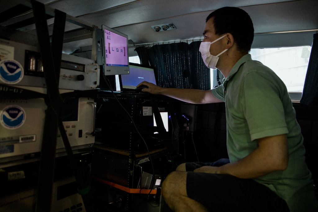 (Rosem Morton | The New York Times)
Xinrong Ren, a University of Maryland researcher, prepares equipment aboard a Cessna that will collect air quality data, in Baltimore, June 24, 2020. The coronavirus pandemic has diminished air pollution markedly, permitting experiments that will inform our understanding of atmospheric chemistry and public health for decades to come.