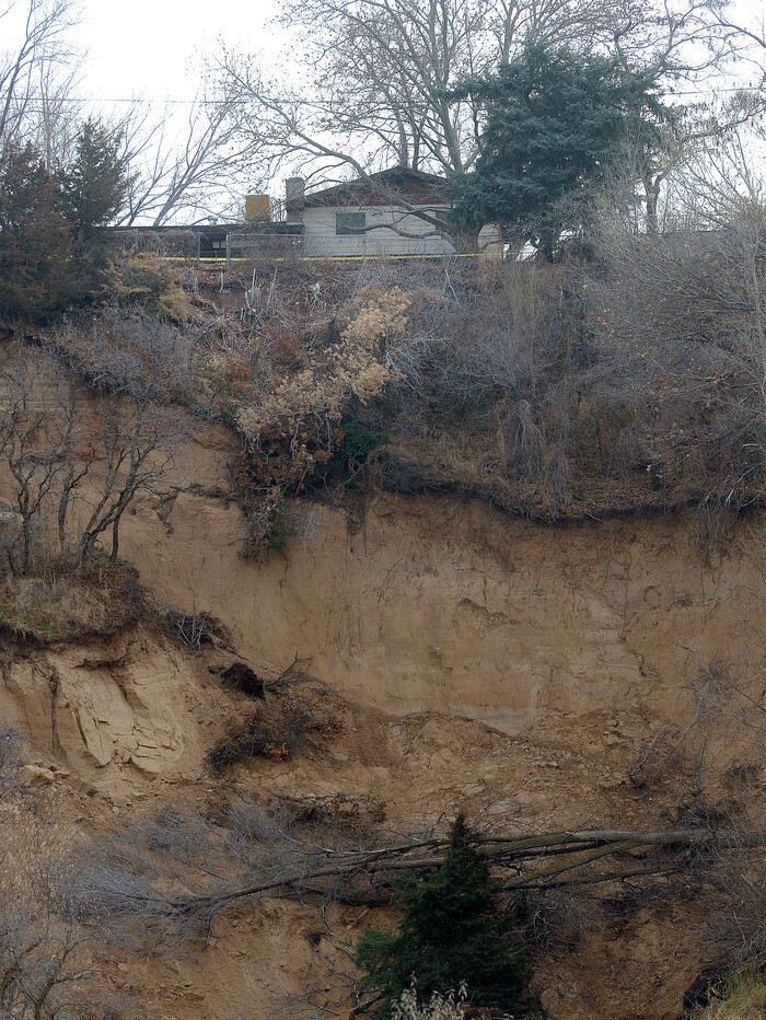 (Al Hartmann | The Salt Lake Tribune)
Unstable slope beneath house near 4860 S. 600 W. in Riverdale Wednesday Nov. 29. Four houses in a row whose backyard's facing west, with railroad tracks and the Weber River Parkway below have been evacuated due to a landslide.