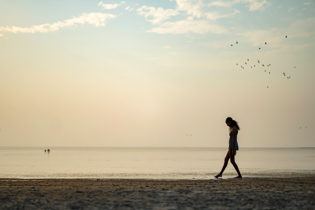 (Rick Egan | The Salt Lake Tribune)  Dibora Sahile wades in the Great Salt Lake, on Thursday, Aug. 8, 2024.