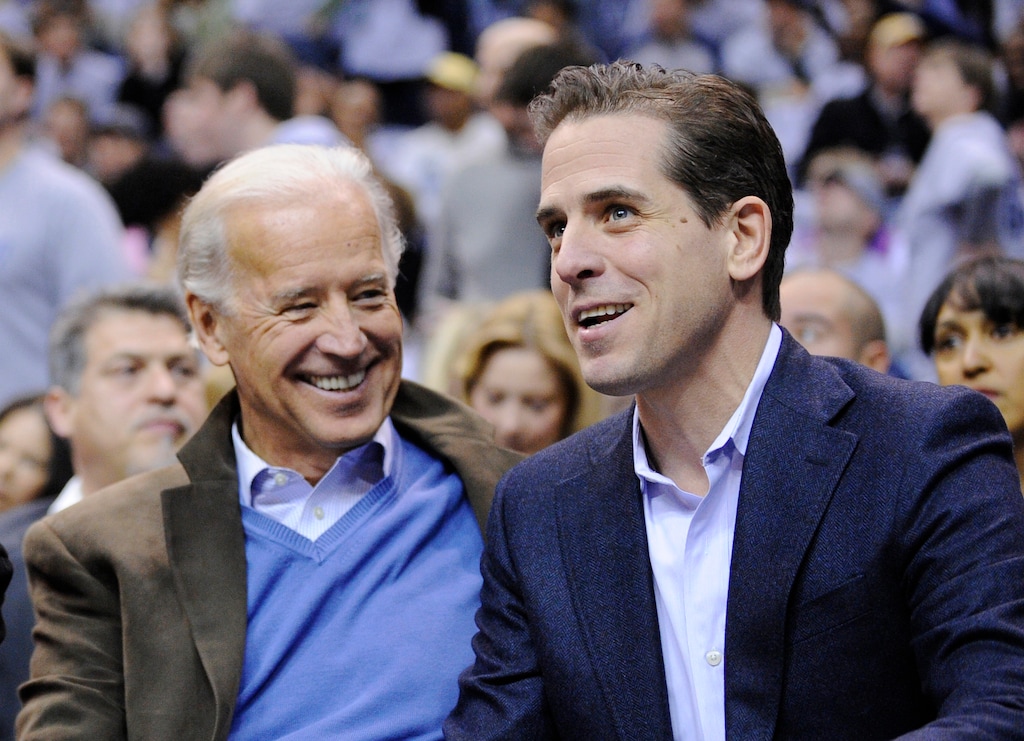 FILE - Then Vice President Joe Biden, left, and his son Hunter Biden appear at the Duke Georgetown NCAA college basketball game in Washington on Jan. 30, 2010. Hunter Biden, an ongoing target for conservatives, has a memoir coming out April 6. The book is called “Beautiful Things” and will center on the younger Biden's well publicized struggles with substance abuse, according to his publisher. (AP Photo/Nick Wass, File)