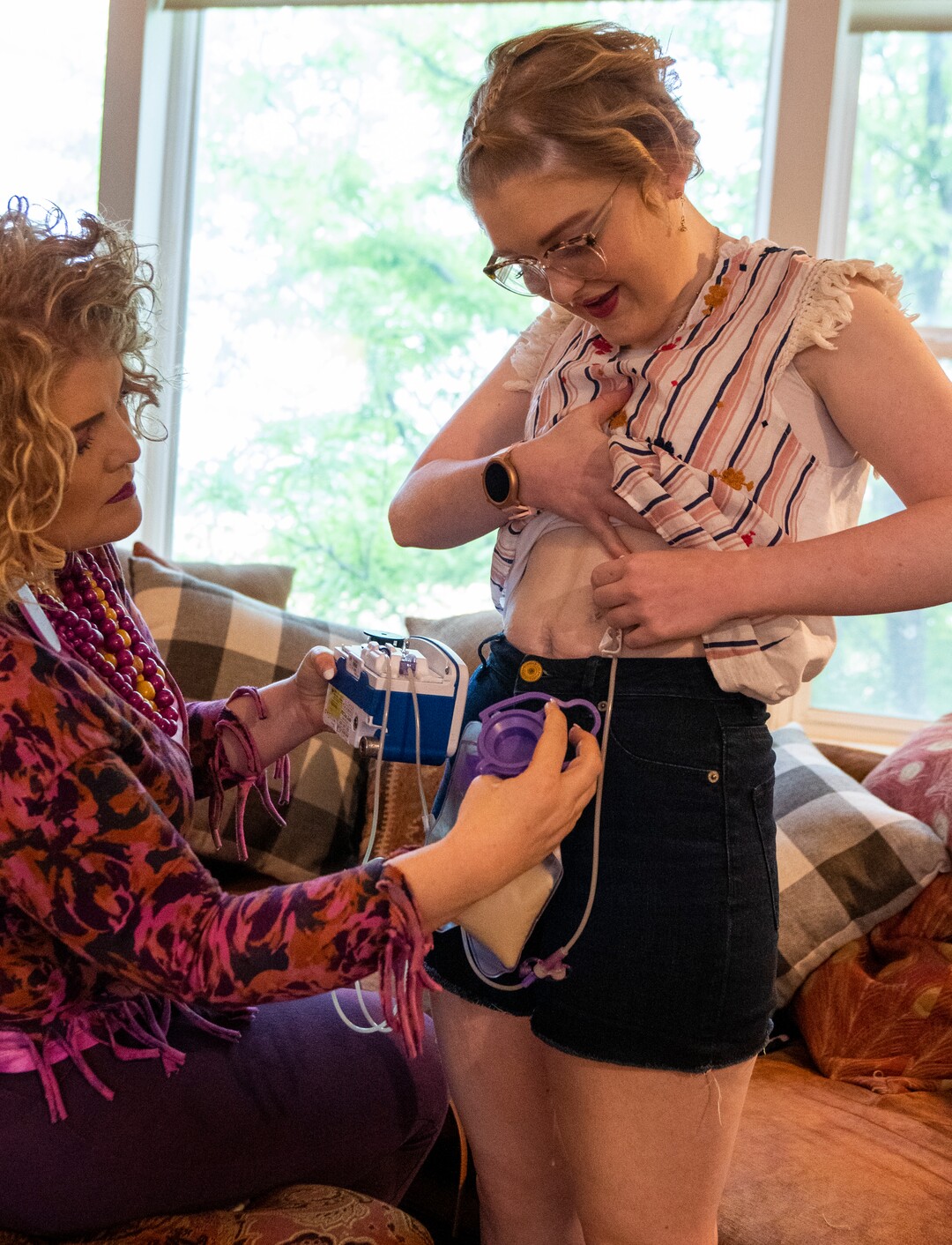 (Rick Egan | The Salt Lake Tribune)  Amanda helps Gracelyn Wilkinson changes her feeding tube, on Wednesday, June 29, 2022. 