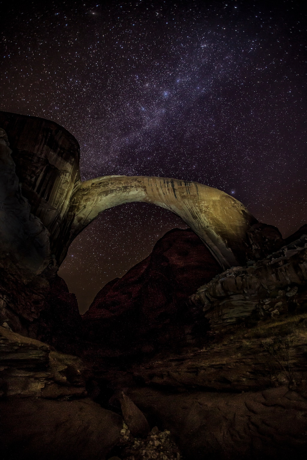 (Brent and Dawn Davis | Courtesy of the National Park Service) Rainbow Bridge, as seen at night. The national monument has been selected as an international dark-sky sanctuary.