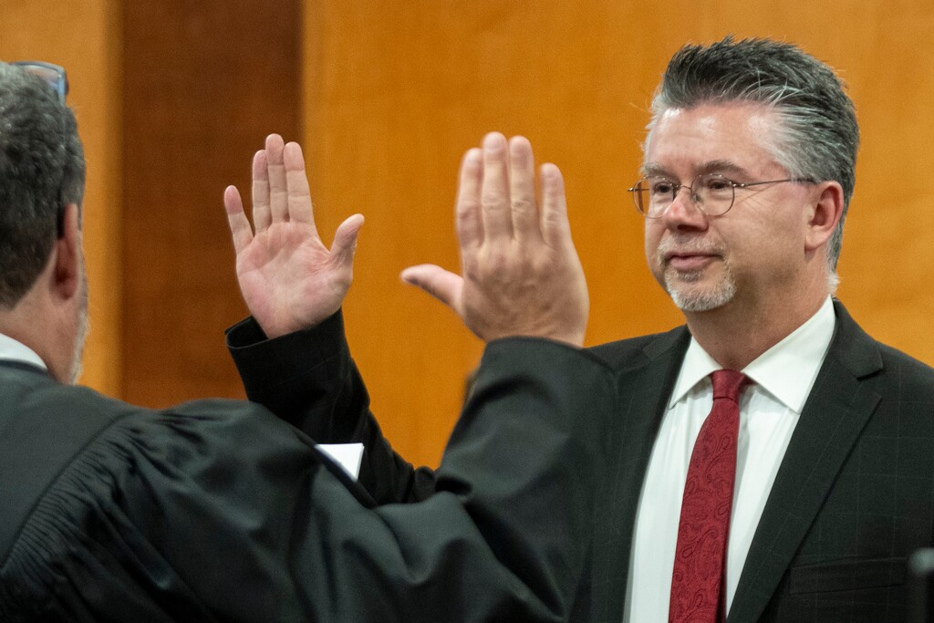 (Rick Egan | The Salt Lake Tribune) Judge Lee Edwards, left, swears in Mark Anderson as the mayor of Logan during the Logan City Council meeting, on Tuesday, Jan. 6, 2026.

