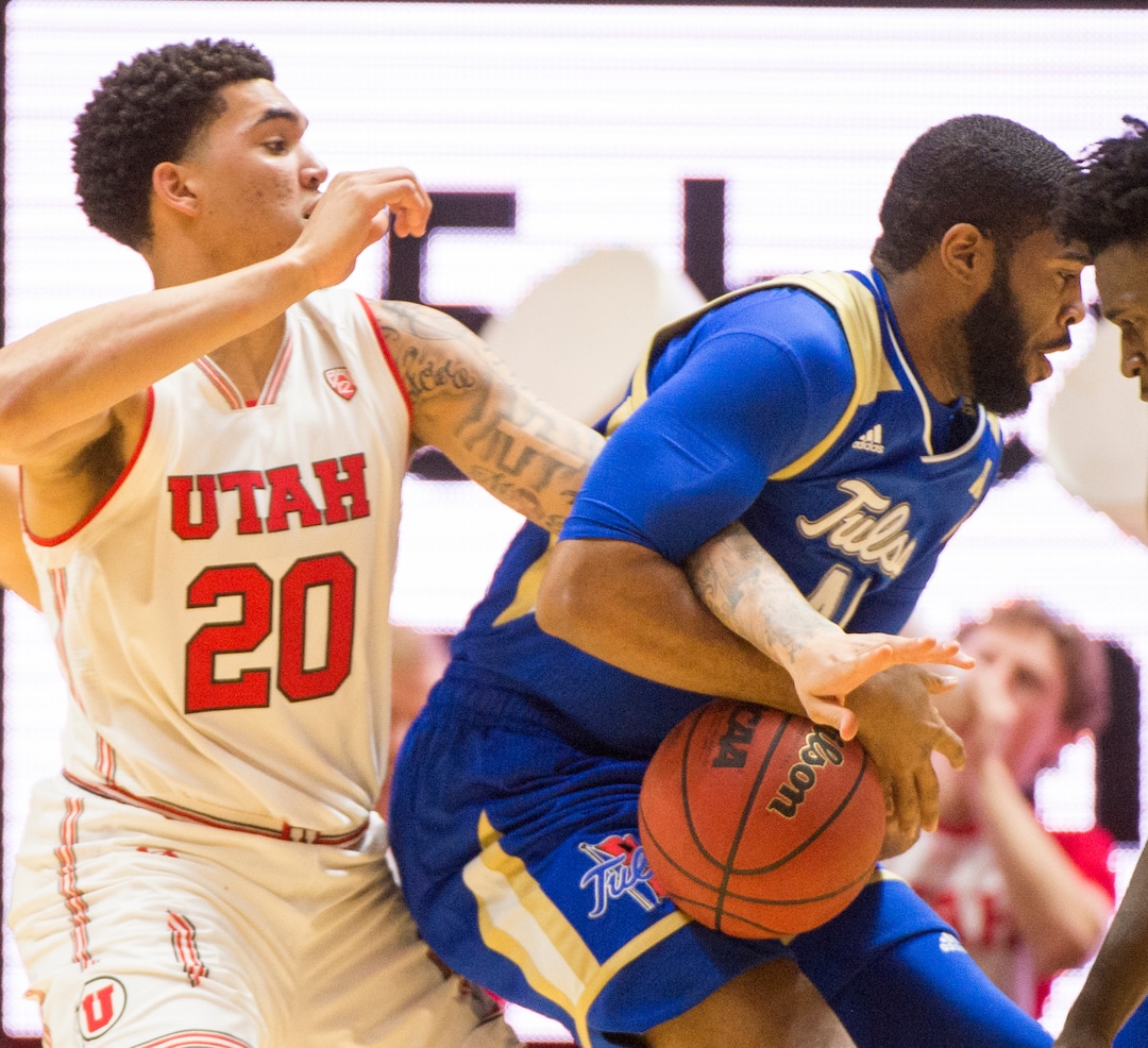 (Rick Egan  |  The Salt Lake Tribune)        Utah Utes forward Timmy Allen (20) gets tangled up with Tulsa Golden Hurricane forward Jeriah Horne (41), in basketball action between, Utah Utes and Tulsa Golden Hurricane, at the Jon M. Huntsman Center, Saturday, Dec. 1, 2018.