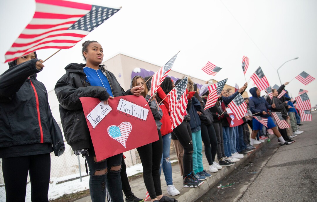 (Keith Johnson  |  special to The Salt Lake Tribune) Students and staff from Granite Park Jr. High line State Street near 3000 South to watch the funeral procession for Officer David Romrell Dec. 5, 2018 in South Salt Lake, Utah. Officer Romrell, a South Salt Lake police officer, was killed in the line of duty Nov. 24th when he was struck by a car driven by a fleeing suspect. 