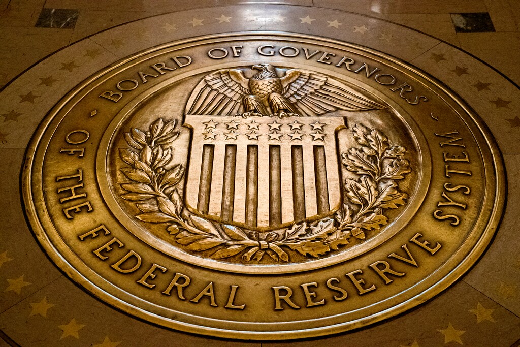 In this Feb. 5, 2018, file photo, the seal of the Board of Governors of the United States Federal Reserve System is displayed in the ground at the Marriner S. Eccles Federal Reserve Board Building in Washington.  (AP Photo/Andrew Harnik, File)