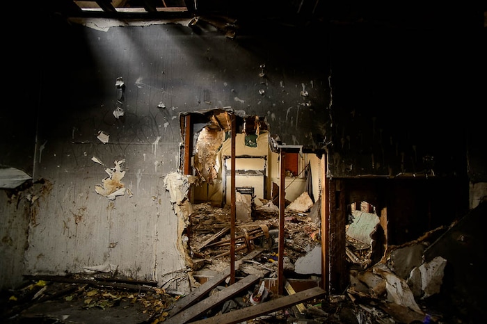 (Trent Nelson | The Salt Lake Tribune) A dilapidated, fire-damaged building near 100 South 700 East in Salt Lake City, Thursday Feb. 15, 2018. Other Side Academy has received approval to demolish it for their expansion.