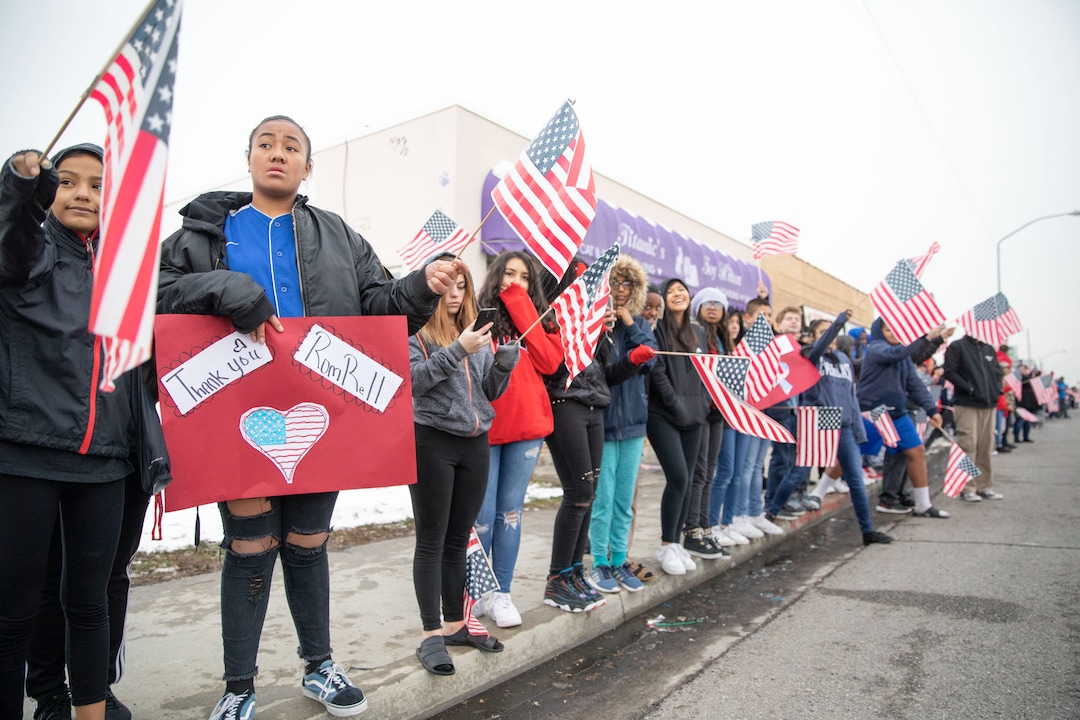 (Keith Johnson  |  special to The Salt Lake Tribune) Students and staff from Granite Park Jr. High line State Street near 3000 South to watch the funeral procession for Officer David Romrell Dec. 5, 2018 in South Salt Lake, Utah. Officer Romrell, a South Salt Lake police officer, was killed in the line of duty Nov. 24th when he was struck by a car driven by a fleeing suspect. 