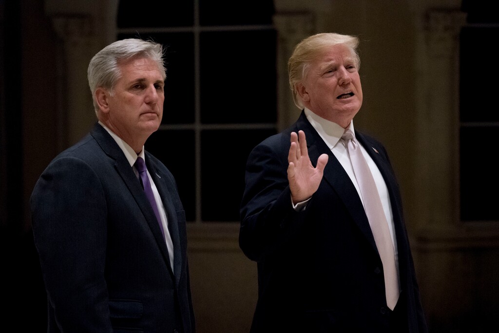(Andrew Harnik | The Associated Press) President Donald Trump, accompanied by House Majority Leader Kevin McCarthy of Calif., speaks to members of the media as they arrive for a dinner at Trump International Golf Club in in West Palm Beach, Fla., Sunday, Jan. 14, 2018. Trump spent the weekend, including Martin Luther King Jr. Day, at the golf course.
