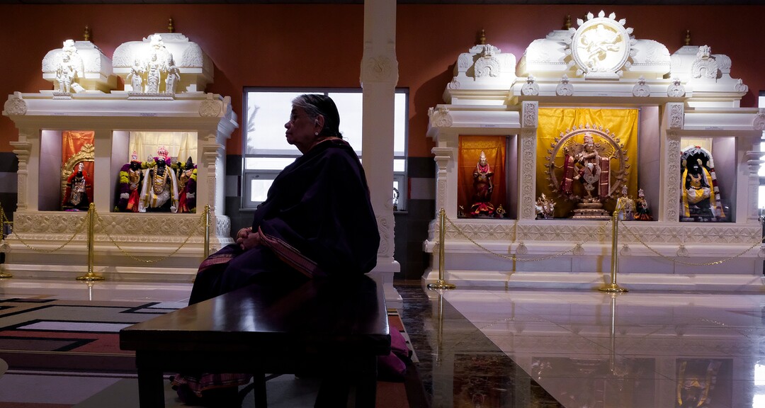 Leah Hogsten  |  The Salt Lake Tribune  Kalyani Gopalan sits in the temple after praying Thursday, March 28, 2019. Artisans from around the world spent two years hand-carving deities in the Sri Ganesha Hindu Temple in South Jordan. 