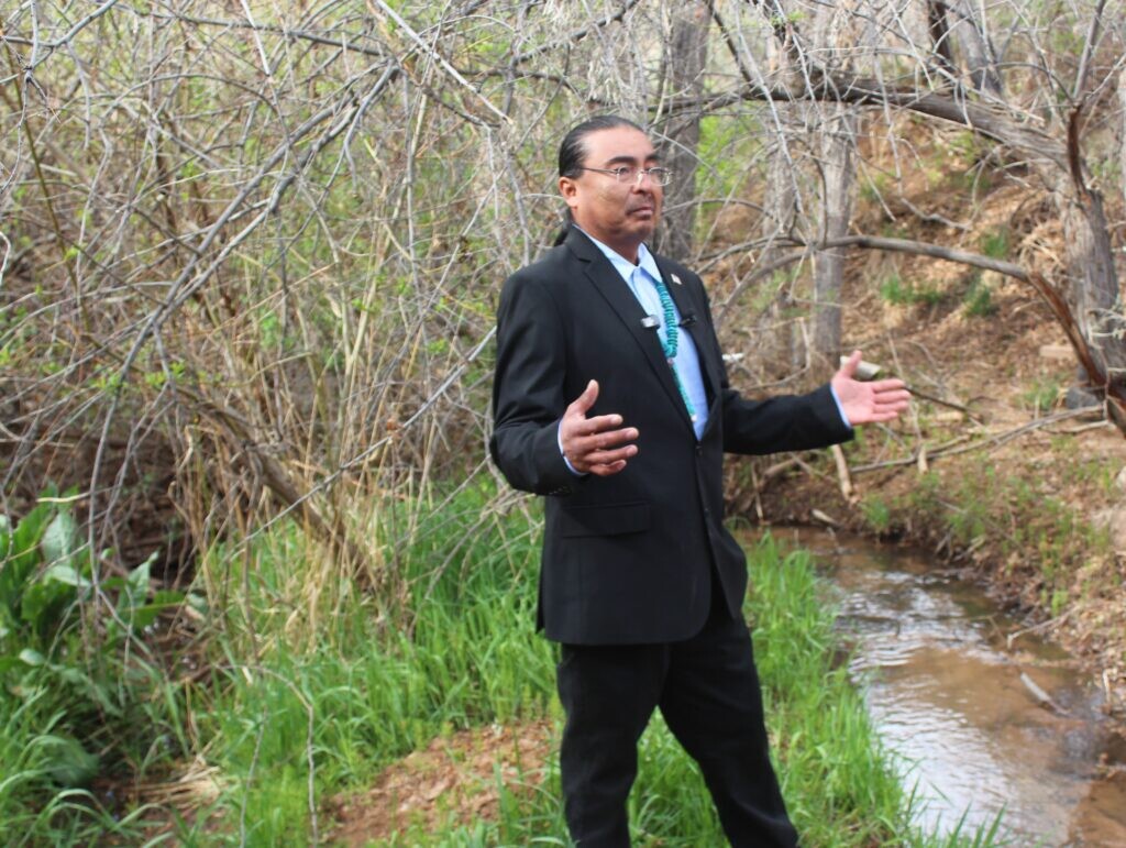 (Andrew Christiansen | The Times-Independent) Thomas Chee, Westwater community president, speaks at the spring where families historically gathered water before the community was connected to a municipal system.