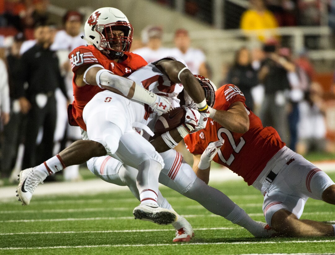 (Rick Egan  |  The Salt Lake Tribune)  Utah Utes linebacker Kavika Luafatasaga (5) and Utah Utes defensive back Chase Hansen (22), bring down Stanford Cardinal running back Bryce Love (20) in PAC-12 football action, Utah Utes vs. Stanford Cardinals, at Rice-Eccles Stadium, Saturday, October 7, 2017.
