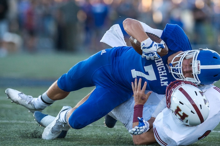 Chris Detrick | The Salt Lake Tribune
Herriman's Taylor Pursley (2) tackles Bingham's Brayden Cosper (7) during the game at Bingham High School Friday August 26, 2016.
