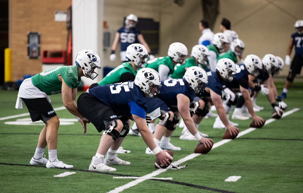 (Jaren Wilkey|Courtesy of BYU Athletics) All the quarterbacks vying for the starting gig left void by the departure of Zach Wilson line up for drills during the first day of spring football, March 1.